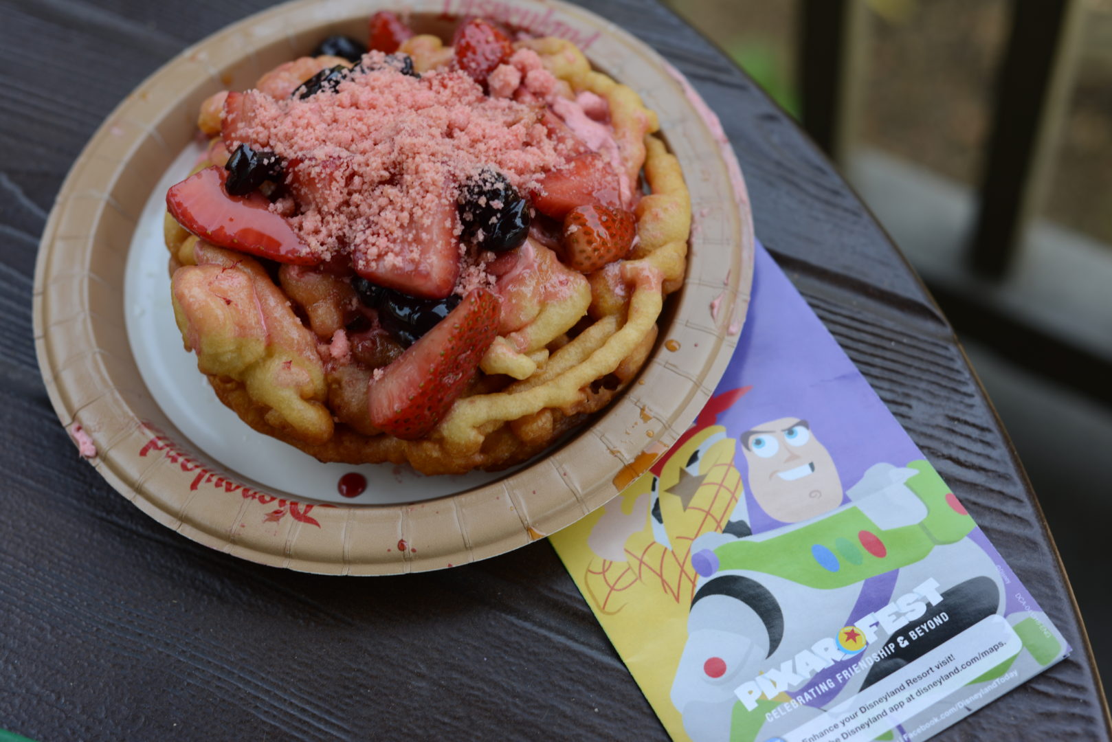 Lots-O Strawberry & Blueberry Funnel Cake with a Disneyland/Pixar Fest Park Map