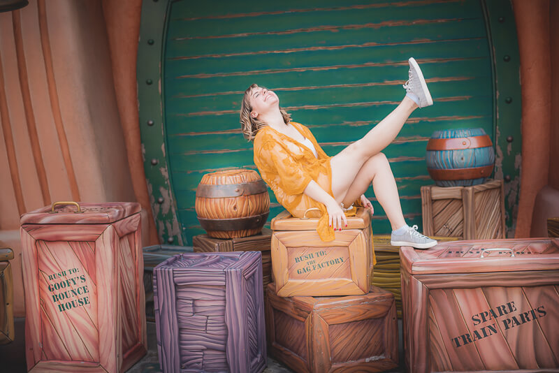 Girl on dynamite and gag factory shipping boxes in Mickey's Toontown at Disneyland, California.