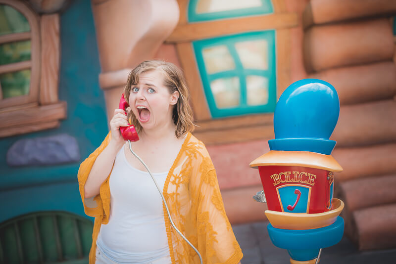 Woman frightened next to Mickey's Toontown Police Phone in Disneyland