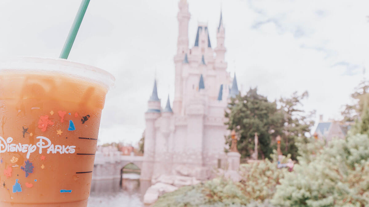 Iced latte in front of Cinderella Castle in Disney World